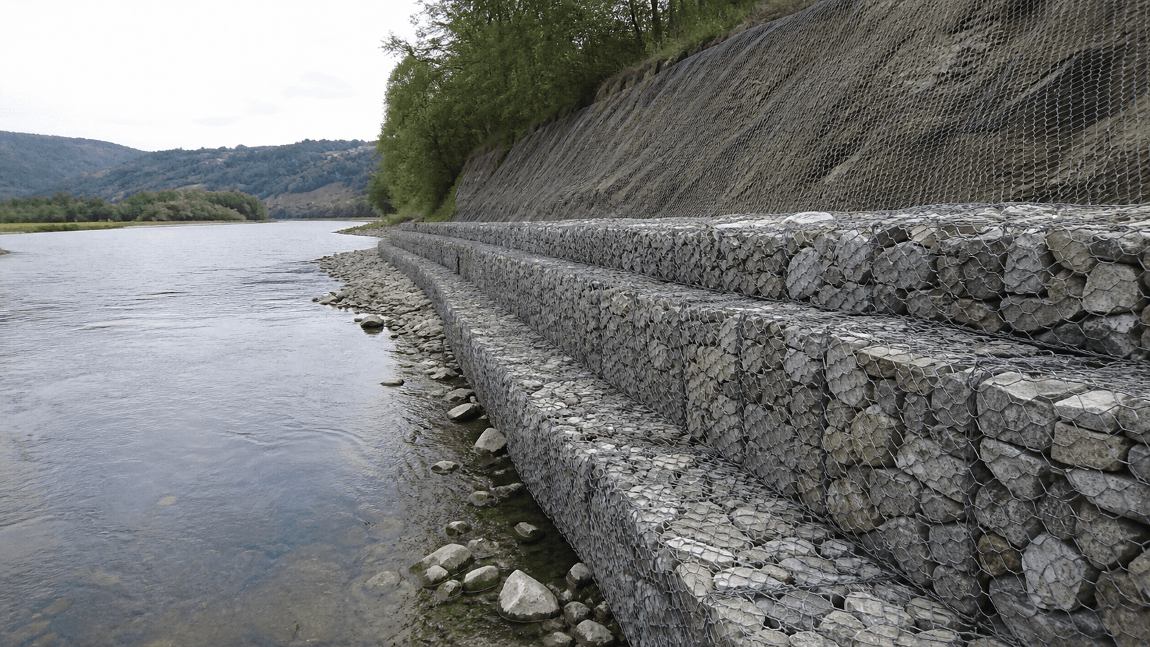 Reference riverbank protected with gabion baskets and slope mesh